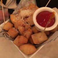 Fried Yucca · Fried yucca root and topped with Parmesan cheese. Vegetarian.