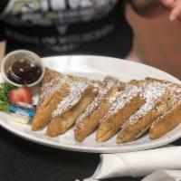 French Toast · 3 thick slices of French toast served with butter & maple flavored syrup and topped with pow...