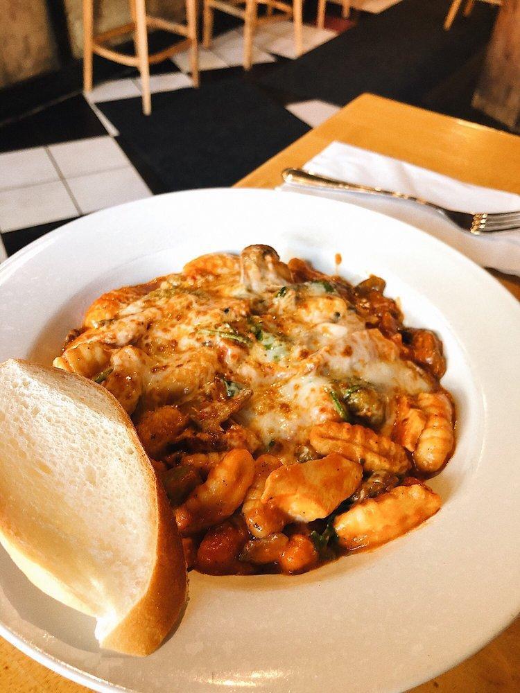 Gnocchi Aurora · Gnocchi dumplings with grilled chicken, mushrooms, spinach and a marinara cream sauce, smothered with melted smoked mozzarella. Served with fresh bread.