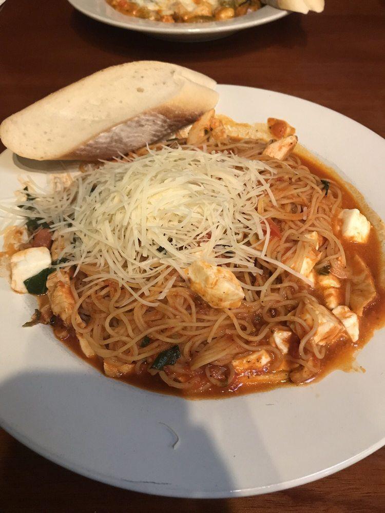 Capellini Pomodoro · Angel hair pasta with marinara, basil and fresh mozzarella, topped with shredded Parmesan. Served with fresh bread.