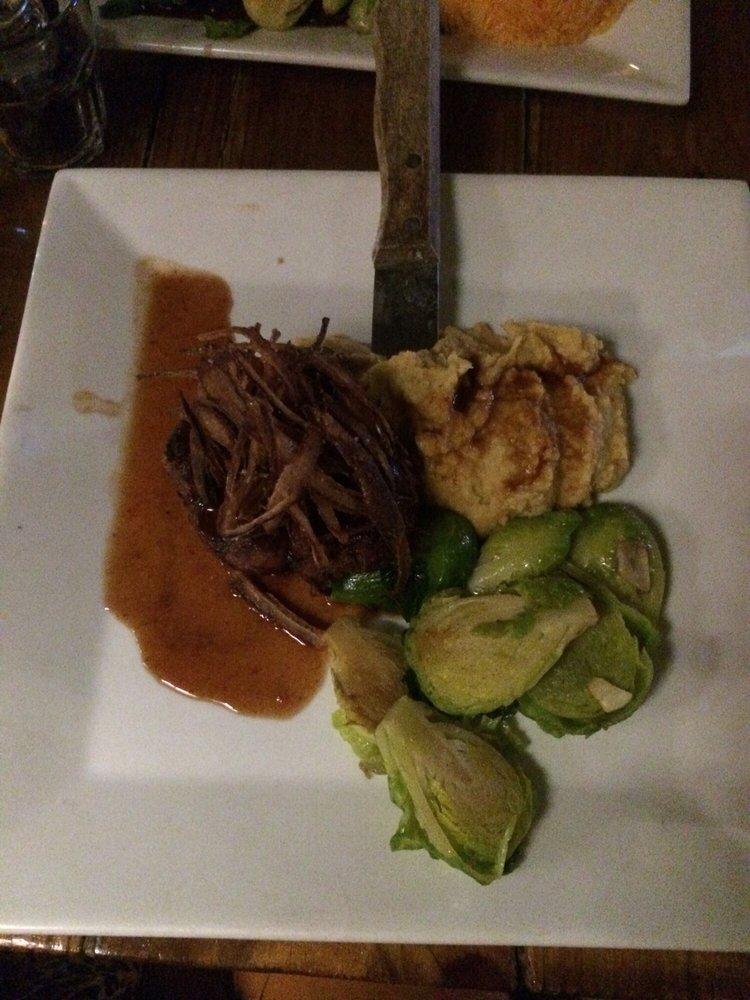 Filet Mignon · Grilled filet mignon medallion served on a tamarindo sauce with chickpea puree, brussel sprouts and crispy onions.