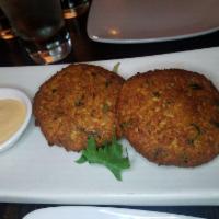 Malabar Crab Cakes · Premium fresh crab meat with herbs and spices, served with aioli sauce.