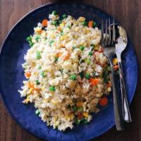 Burmese Fried Rice · Served with eggs, peas, carrots and green onions. Add chicken or shrimp, marinated pork or c...