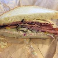 Hot Pastrami Sandwich · Pastrami, Swiss cheese, coleslaw and brown mustard on house bread.
