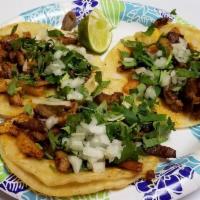 Tacos · You choice of meat with 
Onions and Cilantro 
(1) 
Extra charge for extra salsas and lime. S...