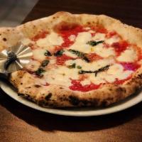 Margherita Pizza · San Marzano tomatoes sauce, fresh mozzarella, basil, pecorino cheese and extra virgin olive ...