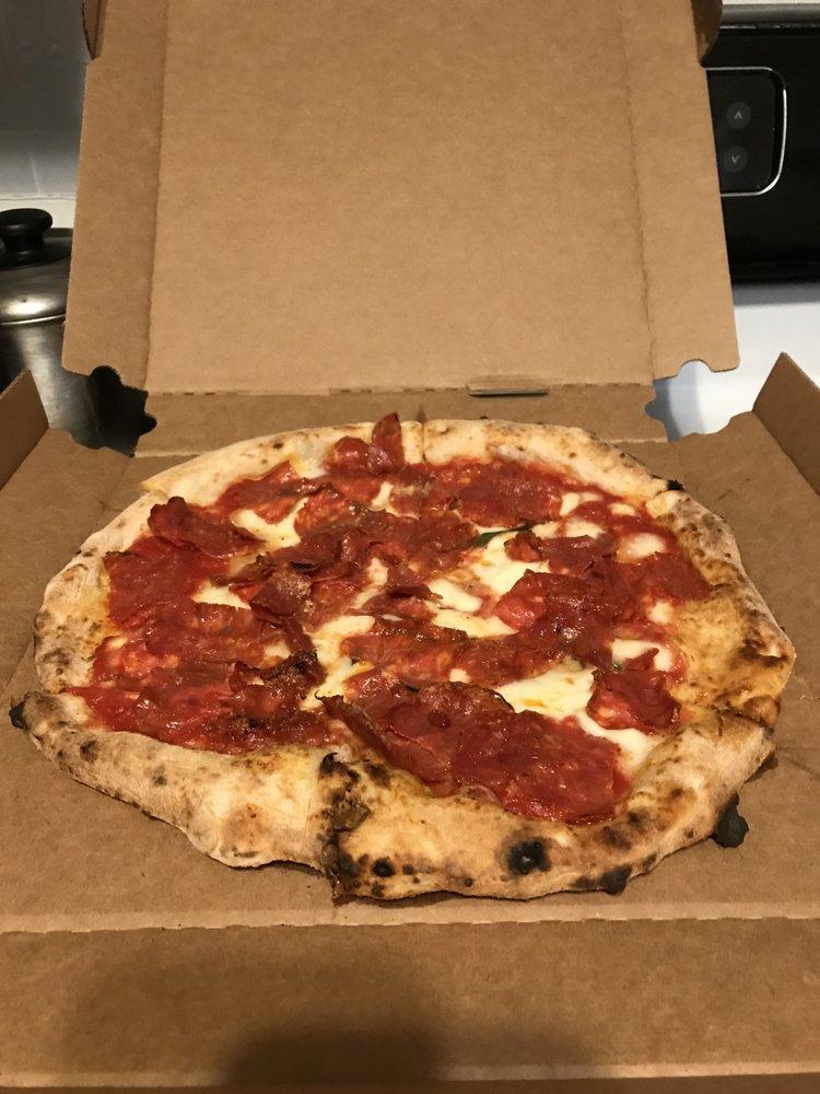 Diavola Pizza · San Marzano tomatoes sauce, fresh mozzarella, spicy soppressata, basil, pecorino and extra virgin olive oil.