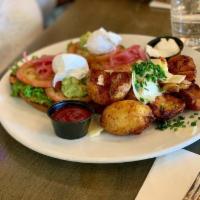 Hass Avocado Toast · Toasted sourdough, topped with hass avocado mash, ricotta cheese, and pickled onions, a poac...