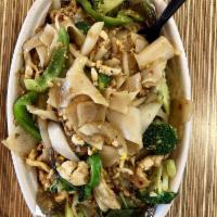 Pad Kee Mao · Drunken noodles. Thick flat rice noodles with egg, Thai basil, white onions, tomato, bell pe...
