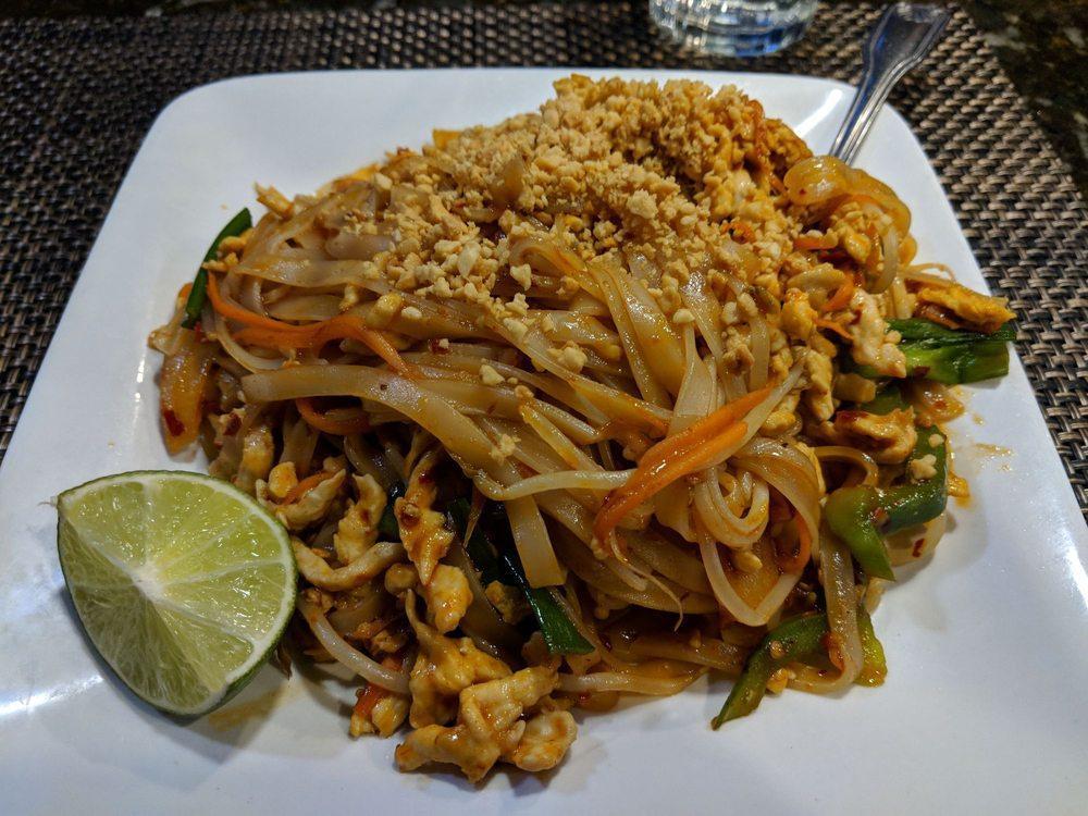 Pad Thai · Rice noodles, egg, carrot, bell pepper, mushroom, scallion, onion, and bean sprout served with cilantro, lime, and crushed peanut.