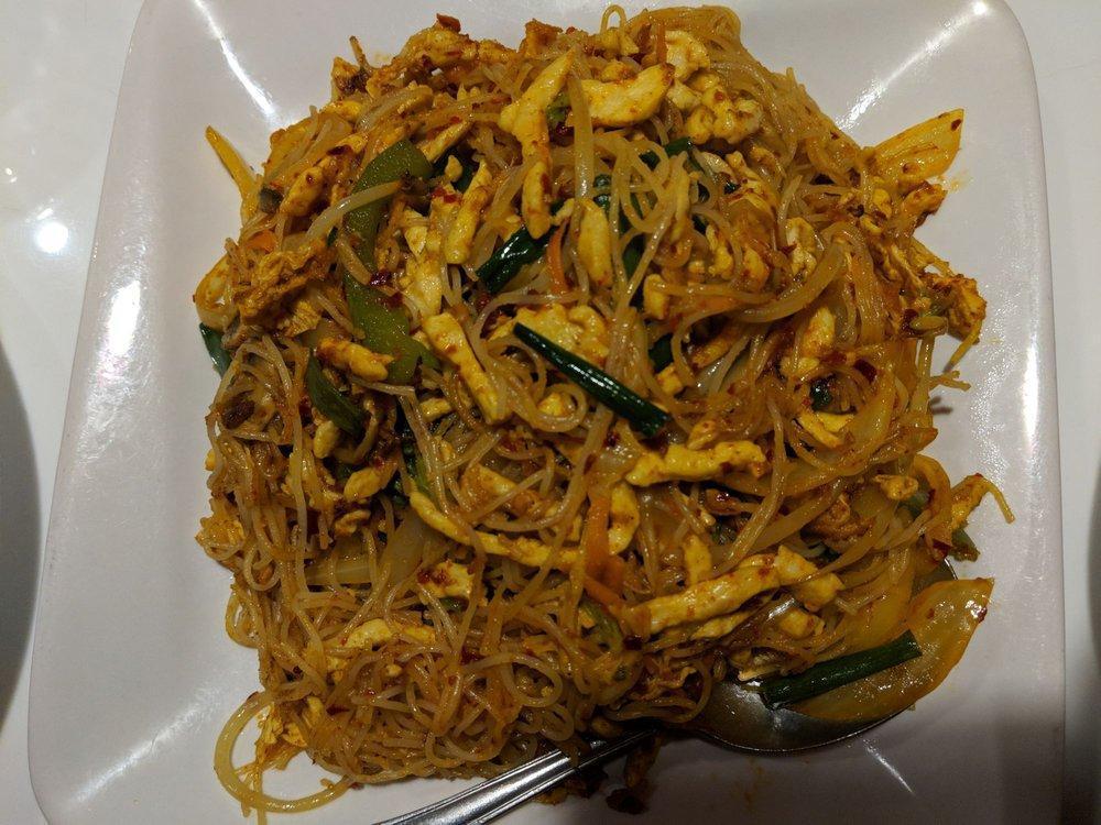Singapore Noodles · Mild. Thin rice noodle stir-fried with onion, scallion, bell pepper, mushroom, bean sprout, napa, and carrot in light yellow curry powder.