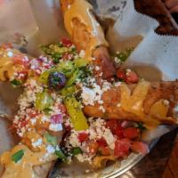 Doquitos · Think Mediterranean taquito, but better. Lavash bread rolled with zesty feta, onion, and gar...