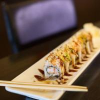 8 Fantasy Roll · Eel, shrimp, avocado and kanikama topped with tempura white fish, eel sauce and sweet chili ...