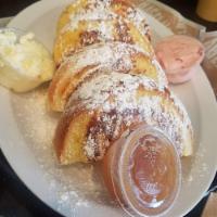 French Toast · Scrumptious slices of egg bagel in cinnamon egg dip, topped with powdered sugar and served w...