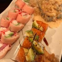 Tucker Roll · Shrimp tempura, asparagus, spicy sauce, scallions topped with sliced salmon and avocado.