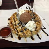 Oreo Waffle · Oreo baked waffle, vanilla creme, and chocolate syrup.