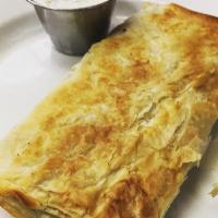 Spanakopita · A crispy and flaky phyllo dough stuffed with spinach and feta cheese that is baked to perfec...