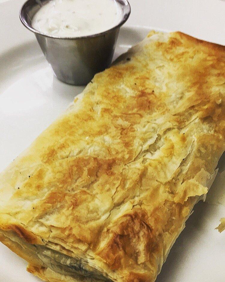 Spanakopita · A crispy and flaky phyllo dough stuffed with spinach and feta cheese that is baked to perfection!