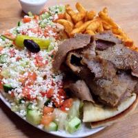 Greek Salad · Lettuce, chopped tomato, cucumber and feta cheese. Homemade vinaigrette and tzatziki on the ...