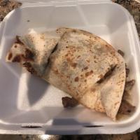 Quesadilla · *No substitutions for seafood fillings*  
A grilled flour tortilla with cheese and your choi...