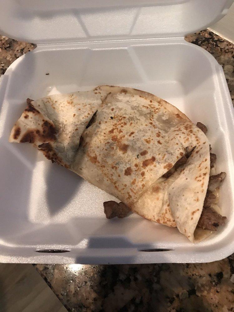 Quesadilla · *No substitutions for seafood fillings*  
A grilled flour tortilla with cheese and your choice of chicken, shredded beef, or ground beef. Served with a side of sour cream and guacamole.