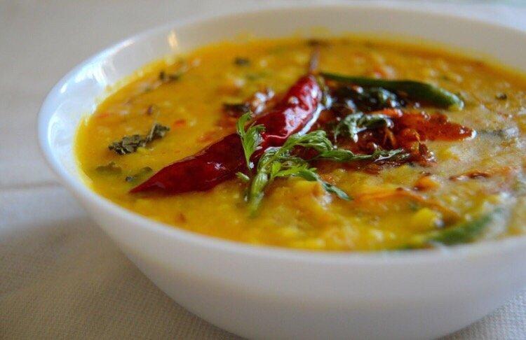 Dal Tadka · Boiled yellow lentil tempered with cumin, mustard, garlic and curry leaves.