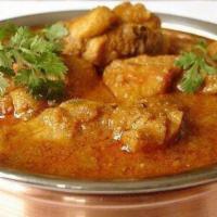 Andhra Chicken Curry · Flavored curry made with sesame and ground onion paste.