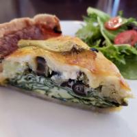 Quiche · Served with side salad.