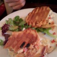 Roasted Chicken Panini · Mediterranean hummus, red onion, Roma tomato and roasted red bell pepper on a dutch crunch r...