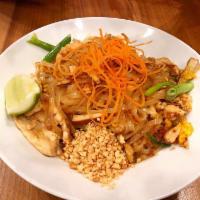 Pad Thai · Rice noodles, chicken, eggs, bean curd, sweet radish, bean sprouts, green onions, roasted pe...