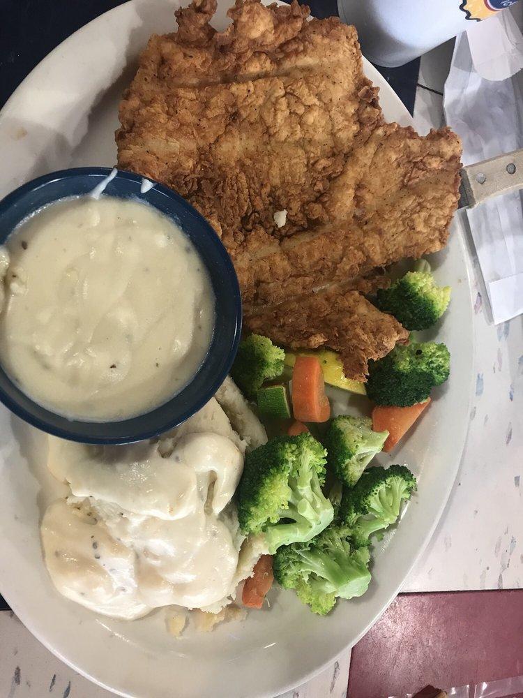 Chicken Fried Chicken · Chicken fried chicken smothered in cream gravy with choice of two sides