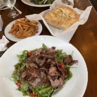 Lamb Gyro · Ground lamb wrapped around a vertical spit and grilled on charcoal fires.