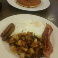 Jumbo Combo · 2 eggs any style, 2 pancakes with 2 bacon, 2 sausages, breakfast potatoes and toast.