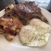 Pork Chops and Eggs · 2 chops with 2 eggs any style and breakfast potatoes, hash browns or fruit.