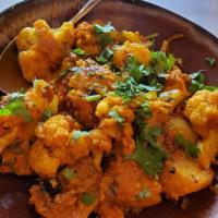 Aloo Gobi · Cauliflower and potato sauteed with caramelized onion, cumin, tamarind, and a hint of butter...