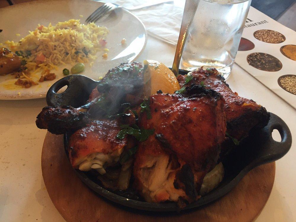 Tandoori Chicken · Marinated organic quarter legs cooked in clay oven and served hot skillet with caramelized onions.