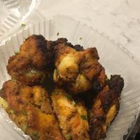 Tandoori Chicken · Bone-in chicken breast and leg marinated in yogurt and freshly ground spices.