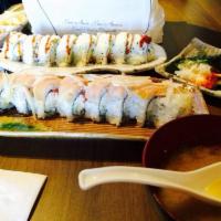 Shrimp Crunch Roll · Shrimp tempura, imitation crab, avocado, & cucumber roll topped w/ tempura crunch & eel sauce.