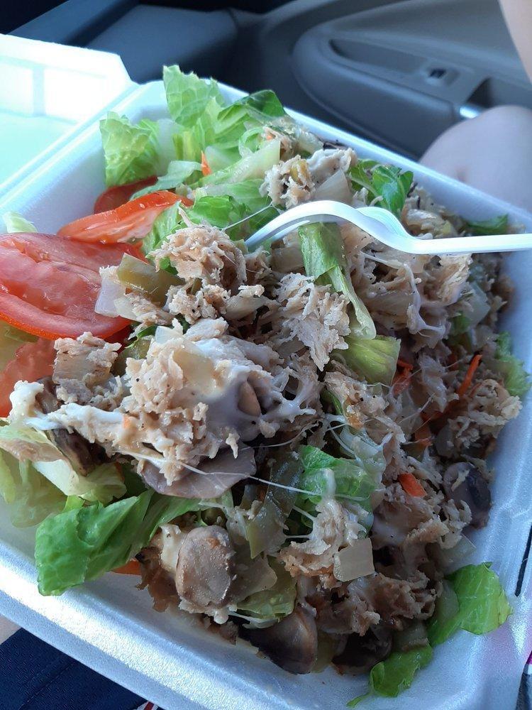 Cheesesteak on Green Salad · Choice of steak or chicken. On romaine lettuce with olives, carrots, and tomato. The protein has grilled onions, bell pepper, and mushrooms. Sides of ranch dressing.
