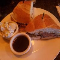 French Kiss Sandwich · Sliced roast beef, portabella mushroom, Swiss cheese and horseradish mayo. Served with au ju...