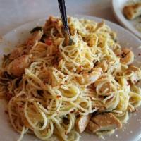 Shrimp Scampi Pasta · Angel hair pasta and shrimp in a delicious scampi sauce, tossed with diced tomatoes and fres...