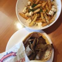 Gyros Pita · Lamb and Beef Gyros, topped with tomato, onions, and homemade taziki sauce.