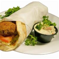 Falafel Pita · A vegetarian, dish blend of garbanzo beans, vegetables and seasonings, deep fried and served...