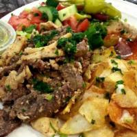 Beef Shawarma ·  Thinly sliced roasted meat.