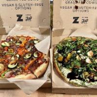 Berkeley Vegan Pizza · Housemade marinara sauce, vegan cheese, beyond meat vegan sausage, roasted zucchini, baby he...