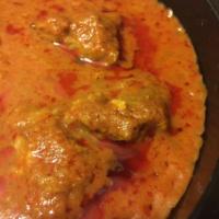 Lamb Vindaloo · Pieces of lamb cooked in a spicy sauce with potatoes, red chilies, and a touch of vinegar. S...