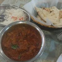 Chicken Vindaloo · Pieces of chicken cooked in a hot tangy sauce with potatoes, red chilies, and a touch of vin...