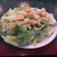 Caesar Salad · Romaine lettuce with Parmesan cheese and croutons tossed with our traditional Caesar dressing.