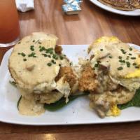 Chicken St Charles · Fried chicken over a buttermilk biscuit, topped with two poached eggs and finished with pork...