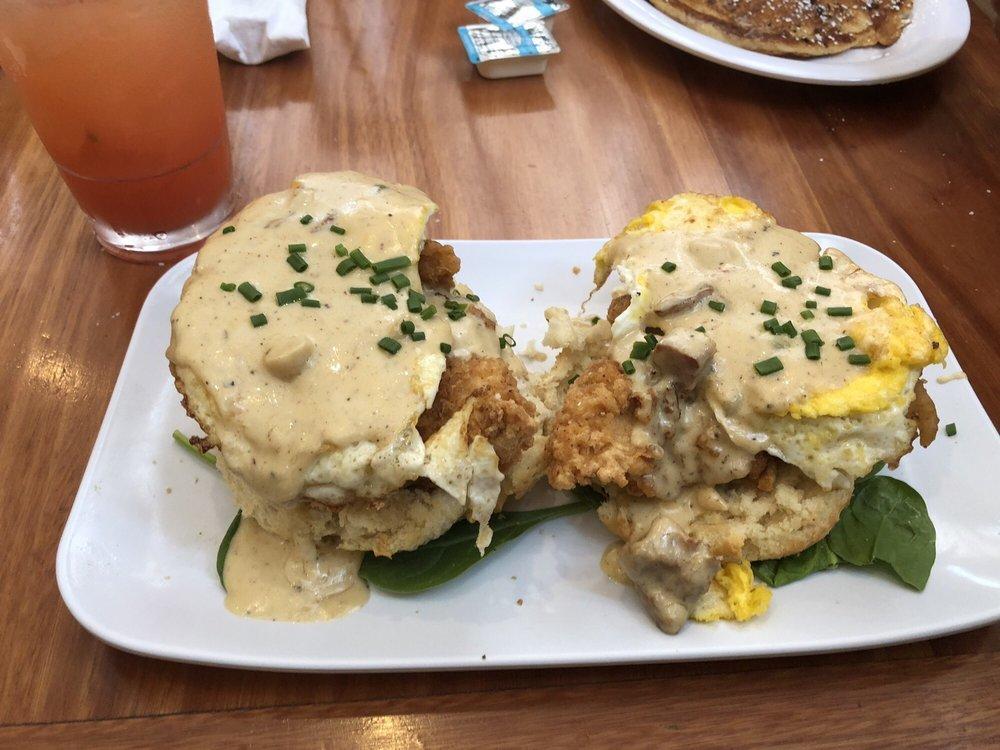 Chicken St Charles · Fried chicken over a buttermilk biscuit, topped with two poached eggs and finished with pork tasso cream sauce